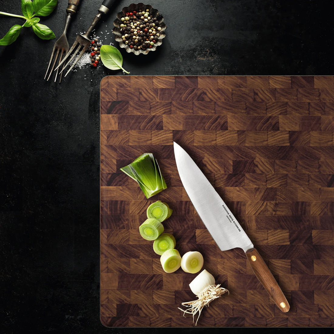 top view of a walnut cutting board with a vbk knife for acacia vs walnut cutting board